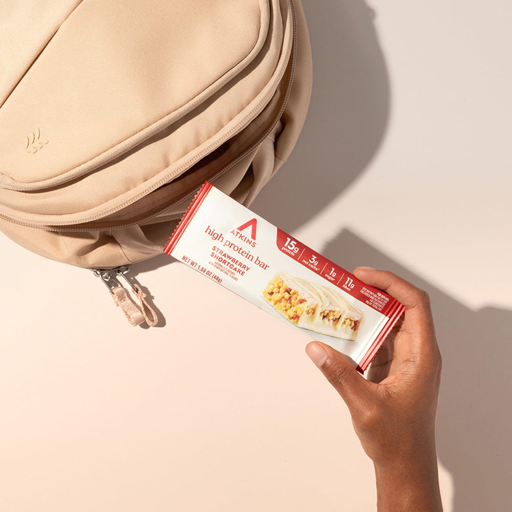 On-the-go moment with Atkins Strawberry Shortcake Bar snack