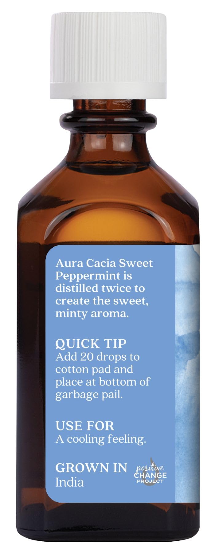 Close-up of Aura Cacia Sweet Peppermint oil label showing purity and sourcing