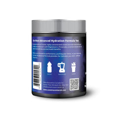 Scooping powder into glass to create sugar-free hydration with magnesium L-threonate.