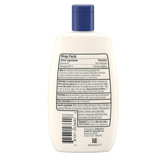 Aveeno anti-it ch lotion bottle-pour image showing easy application
