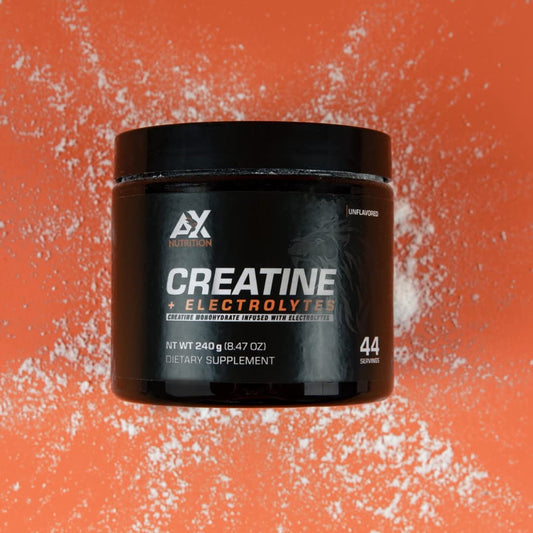 AX Nutrition Creatine + Electrolytes powder scoop prepared for a pre-workout serving.