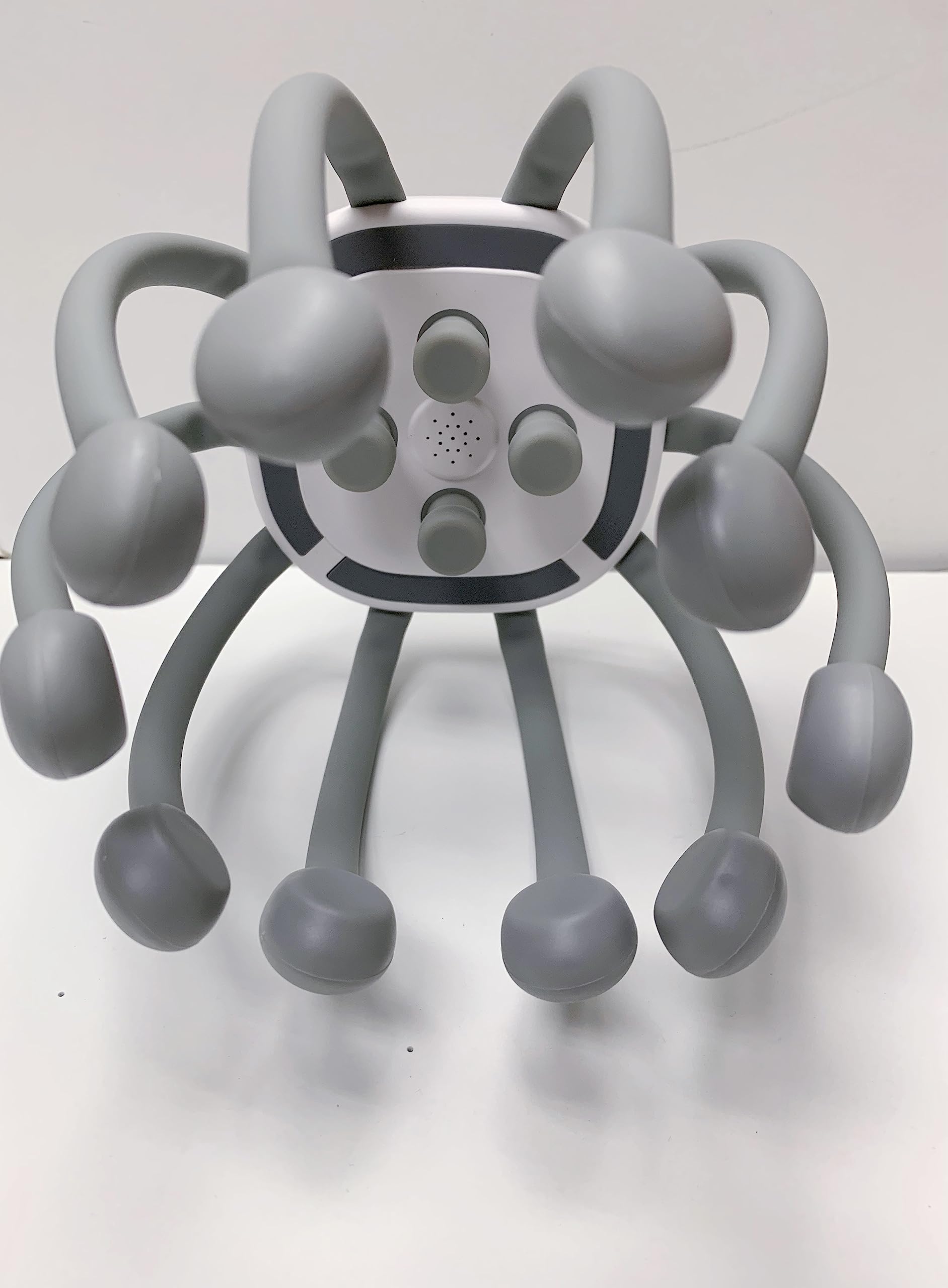 Azpen head massager streaming Bluetooth music during a massage