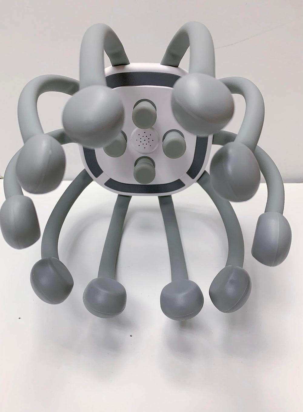 Azpen head massager streaming Bluetooth music during a massage