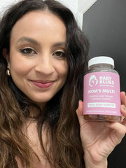 Baby Blues Mom's Multi Daily Gummies in hand for portable daily wellness.