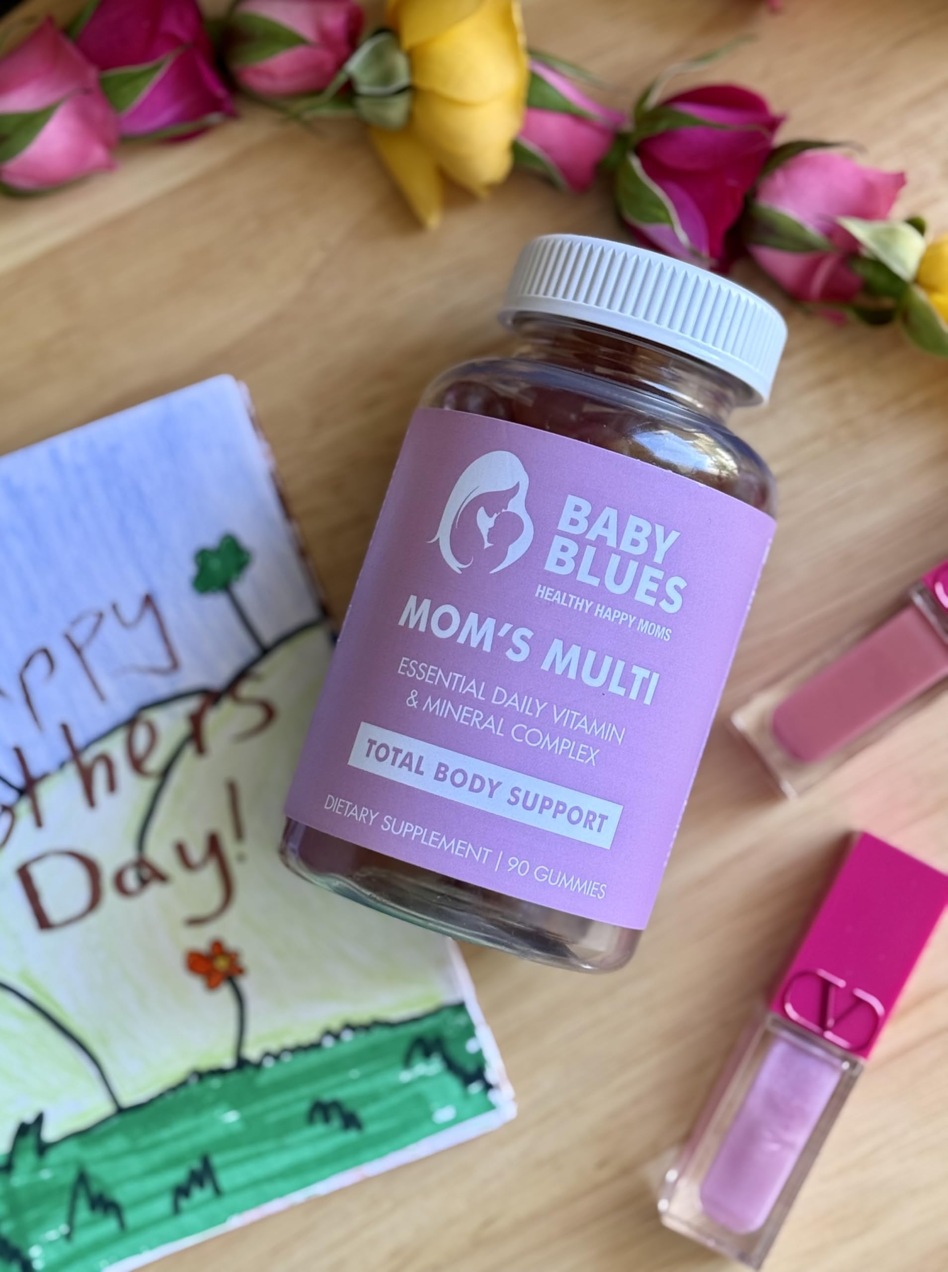 Baby Blues Mom's Multi Daily Gummies on table suggesting everyday hair, skin, and nails support.