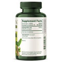Banyan Botanicals Ashwagandha tablets beside water for sleep support.