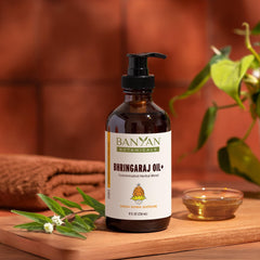 Banyan Botanicals Bhringaraj Oil+ pour into palm demonstrates soothing application