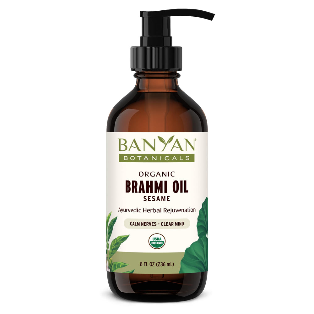 Banyan Botanicals Brahmi Oil bottle pours for calming self massage