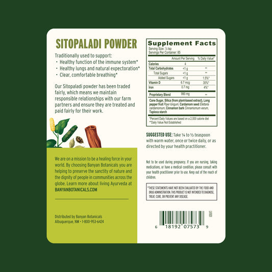Banyan Botanicals Sitopaladi Powder scoop demonstrates convenient daily use for immune support.