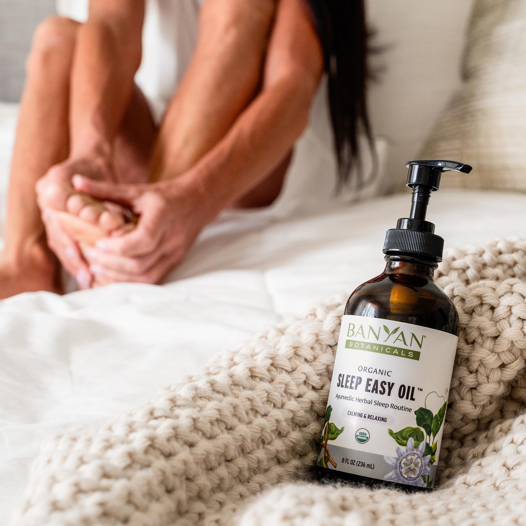 Dropper of Banyan Sleep Easy Oil ready for precise application.