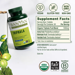 Banyan Botanicals Triphala tablets label close-up highlights organic, non-GMO credentials.