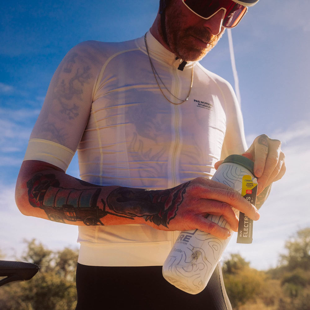 On-the-go lifestyle scene with ready-to-mix electrolyte sachets.