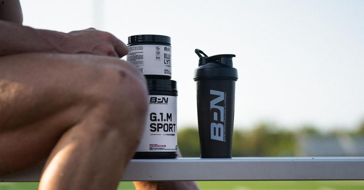 BARE PERFORMANCE NUTRITION G1.M bottle held by athlete ready for training.