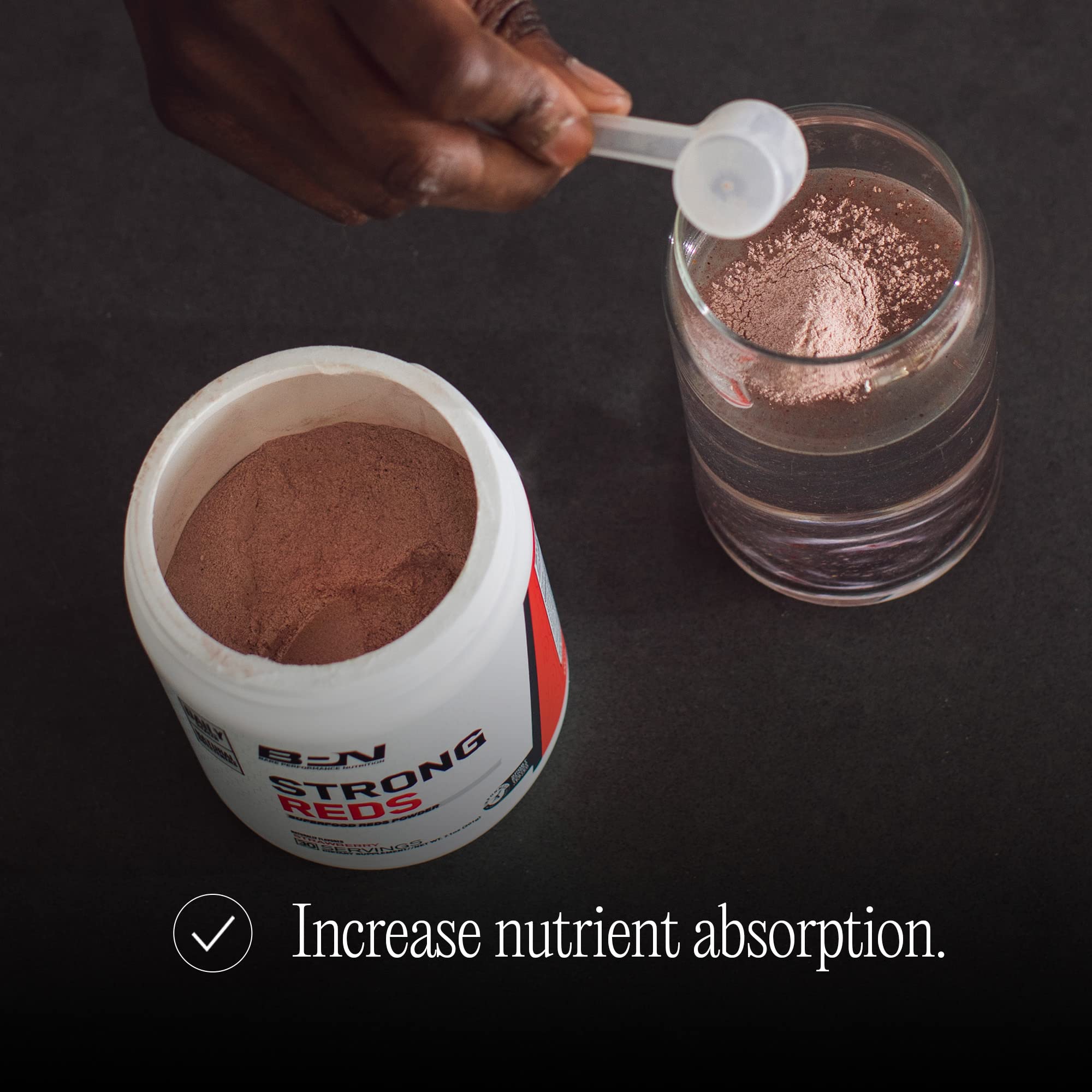 BARE PERFORMANCE NUTRITION strawberry-flavored scoop shows powder ready for smoothies.