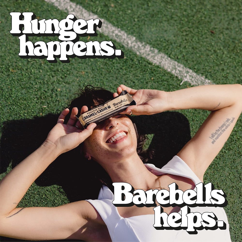 Barebells bars held in hand for on-the-go snacking