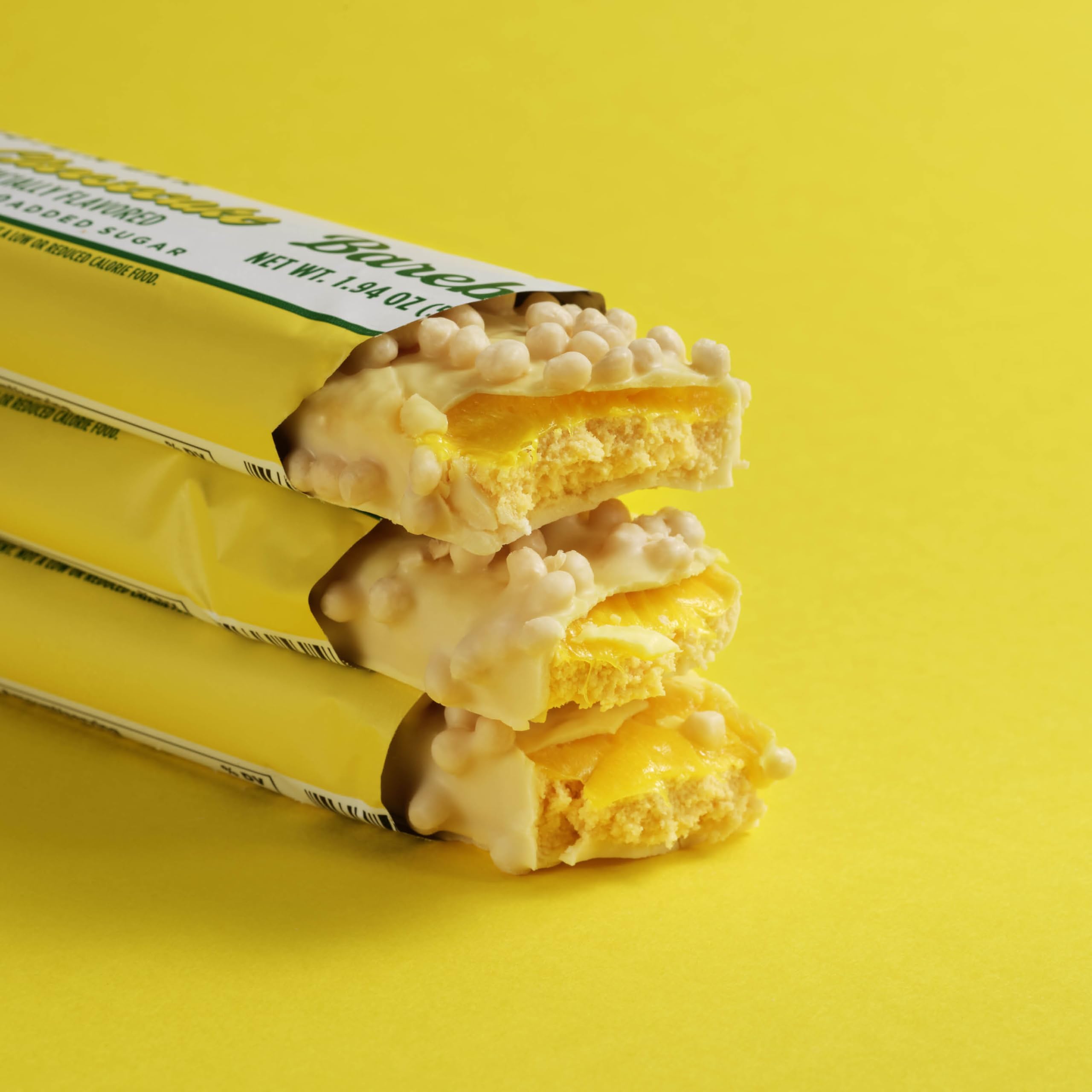 Barebells Lemon Cheesecake bar in hand, energy boost on the go.