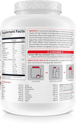 Basic Supplements Mass Gainer protein powder scoop demonstrates balanced macros for workouts.