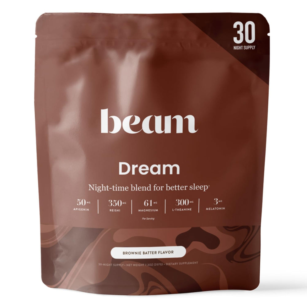 Beam Dream Sleep Powder brownie batter tub on countertop signals a calming routine.
