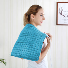 Safety label close-up on BEAUTIKEN heating pad with usage notes