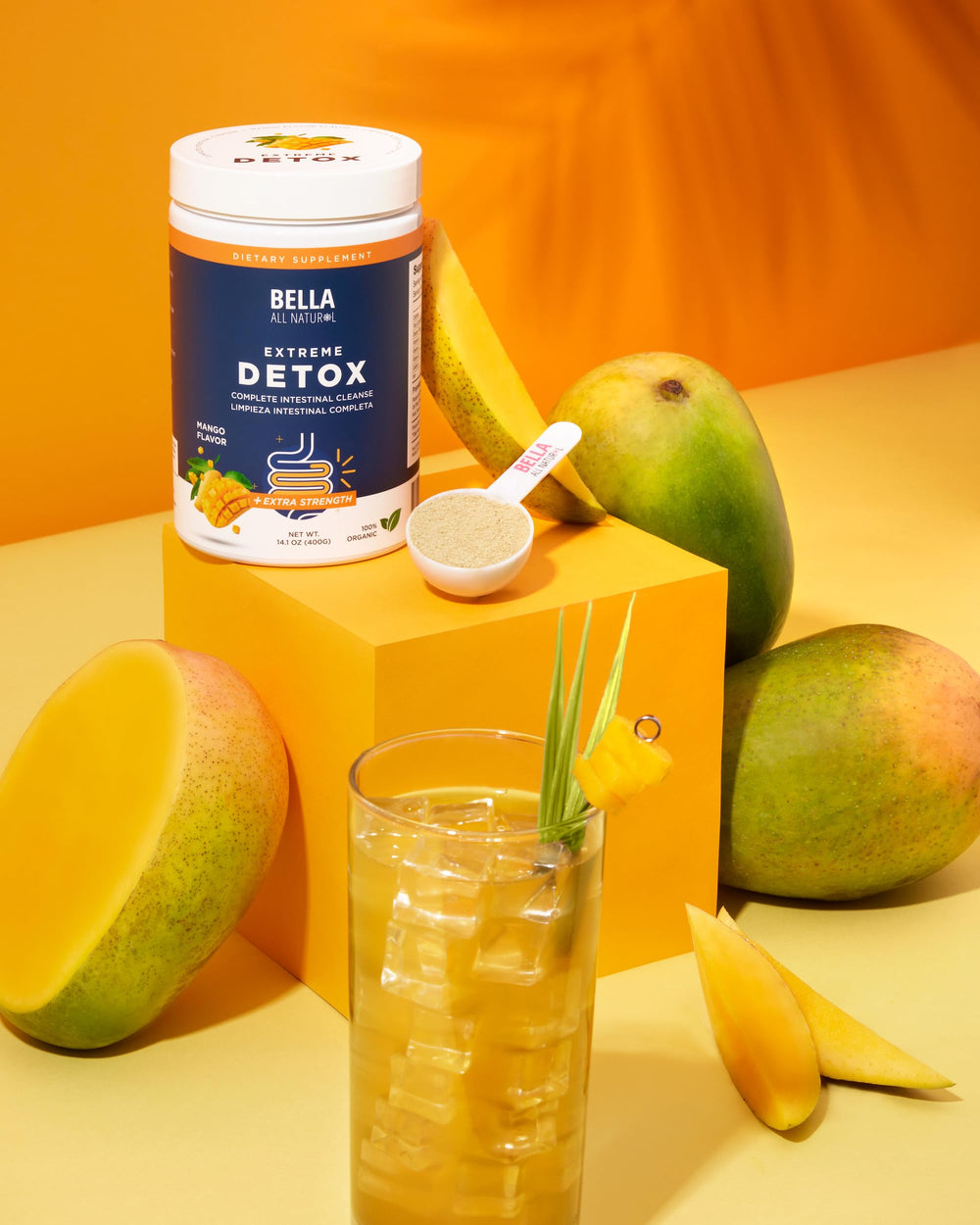 Bella All Natural Detox Powder Mango scoop ready for easy use in water