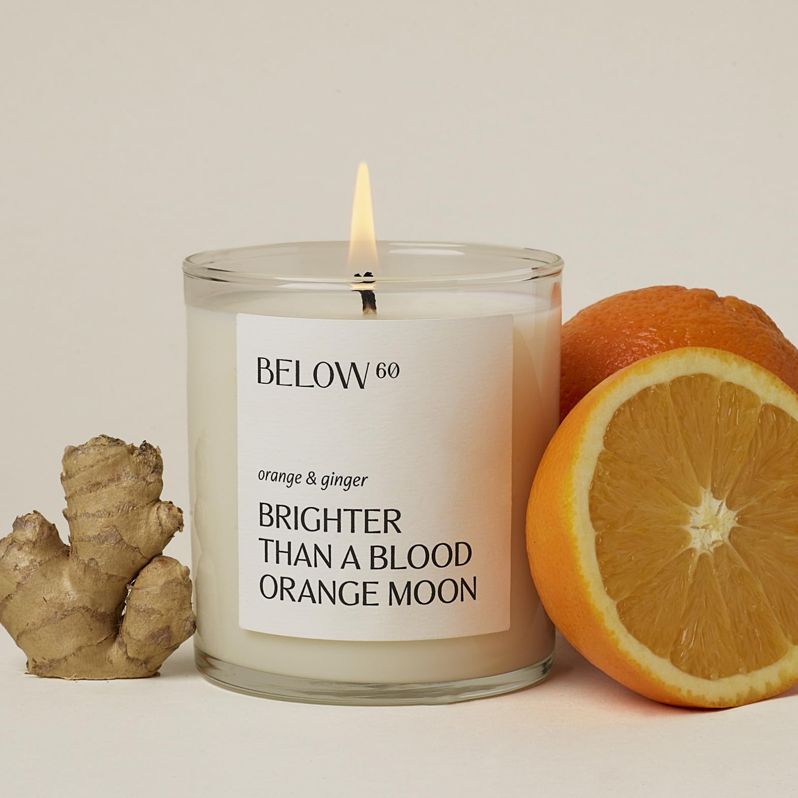 Below 60 blood orange ginger candle closeup for vibrant mood boost