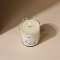 Below 60 blood orange ginger candle side view for daytime glow