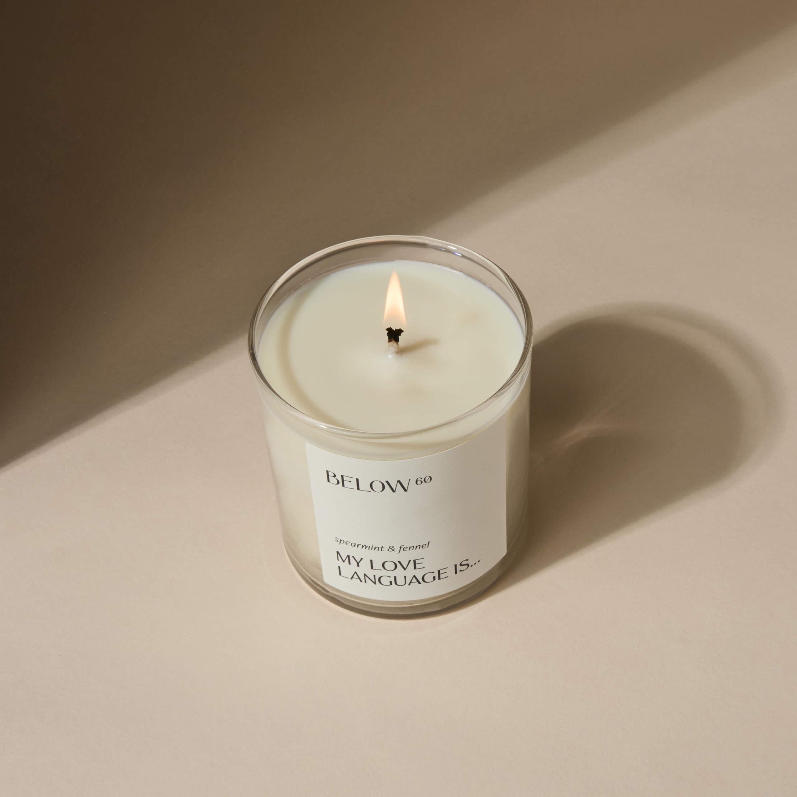 Below 60 cotton-wick candle provides steady burn and lasting fragrance