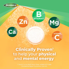 Berocca Energy orange tablet dissolving in water during a study session.