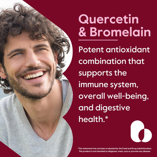Close-up of quercetin-bromelain capsules poured for digestion support