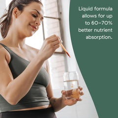 Liquid multivitamin in kitchen setting with drinks.