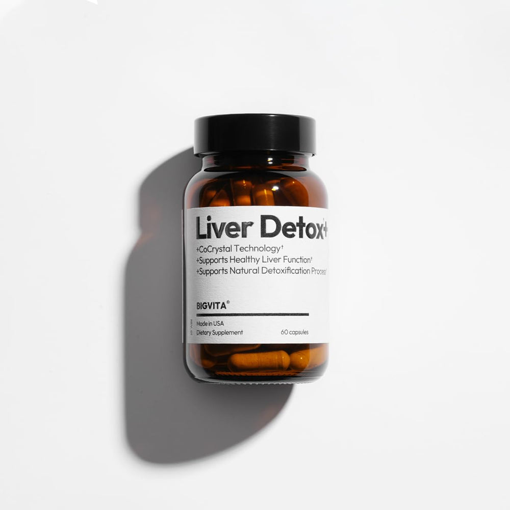 BIGVITA CoCrystal Liver Detox+ bottle beside a mirror suggesting routine wellness.