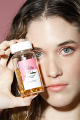 Bikini Burn flax seed oil capsules beside a healthy salad.
