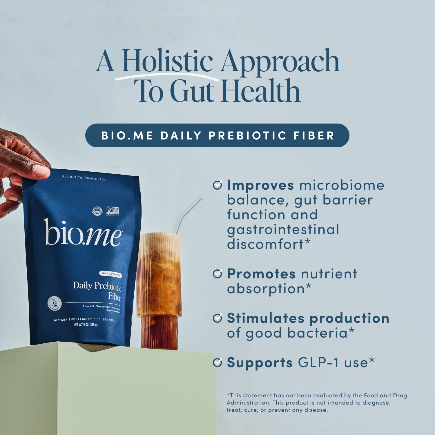 Bio.me Daily Prebiotic Fiber Powder in water glass for easy daily fiber addition.