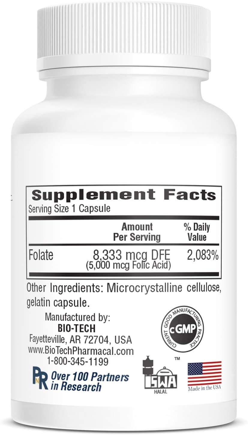 Person taking Bio-Tech Pharmacal folic acid 5mg capsules for daily supplementation.