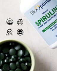 BioOptimal spirulina tablets vegan-symbol indicates plant-based nutrition.