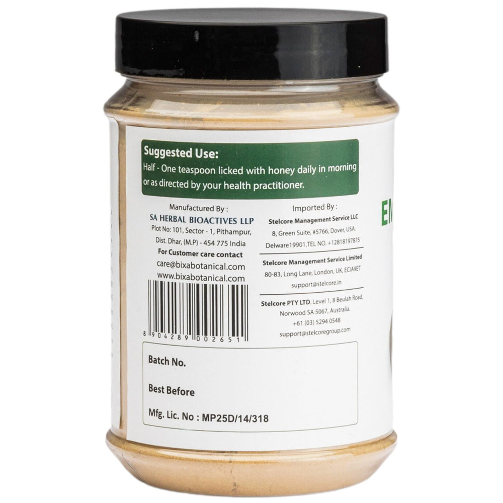bixa BOTANICAL emetic nut powder with a measuring scoop demonstrates convenient dosing for tea.