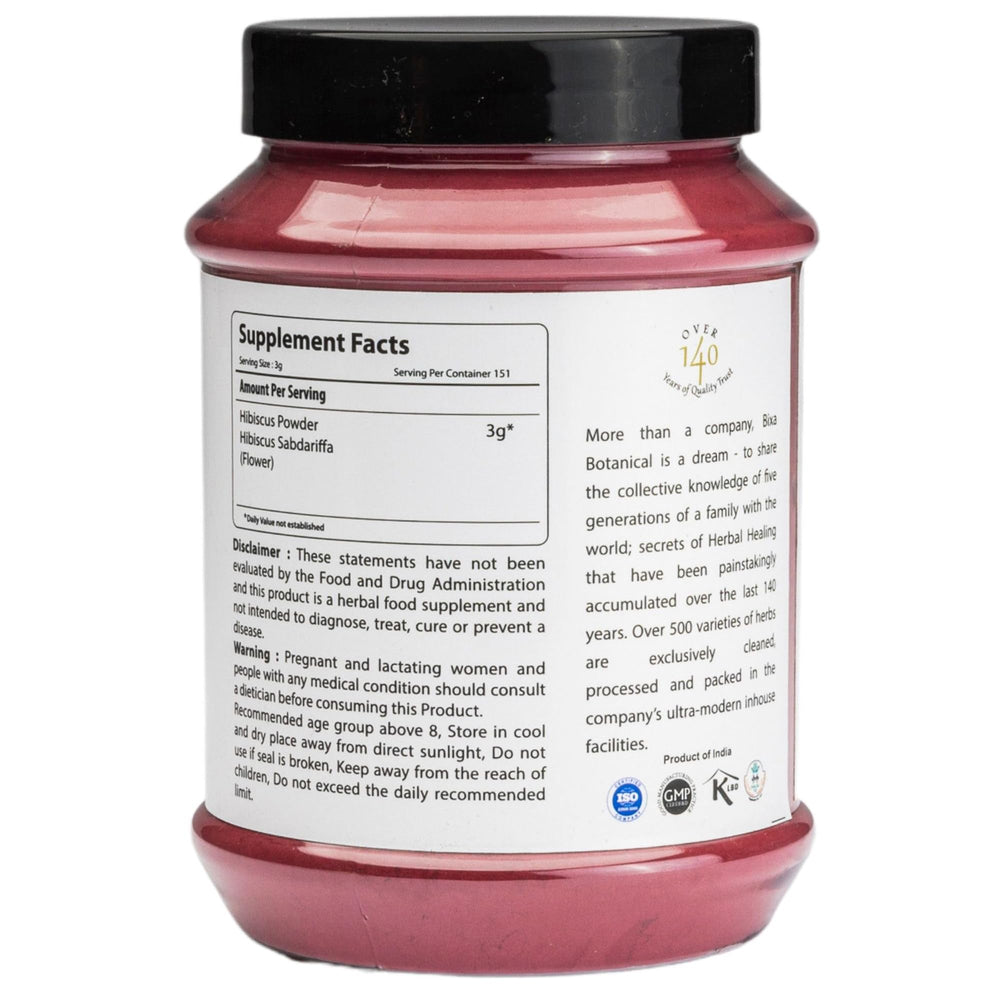 Close-up of Bixa Botanical Hibiscus Powder texture showing a fine, antioxidant-rich formula.