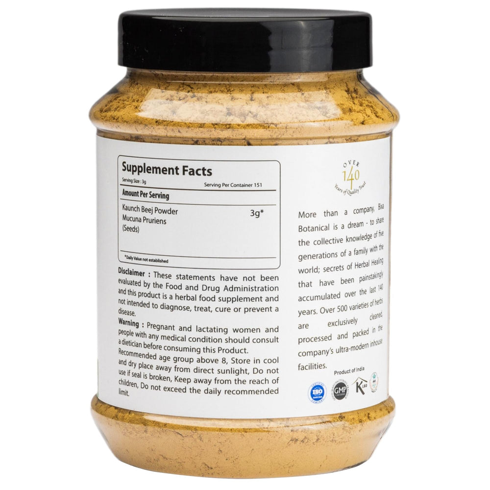 Scoop beside glass of water, suggesting beverage mixing with Mucuna powder.