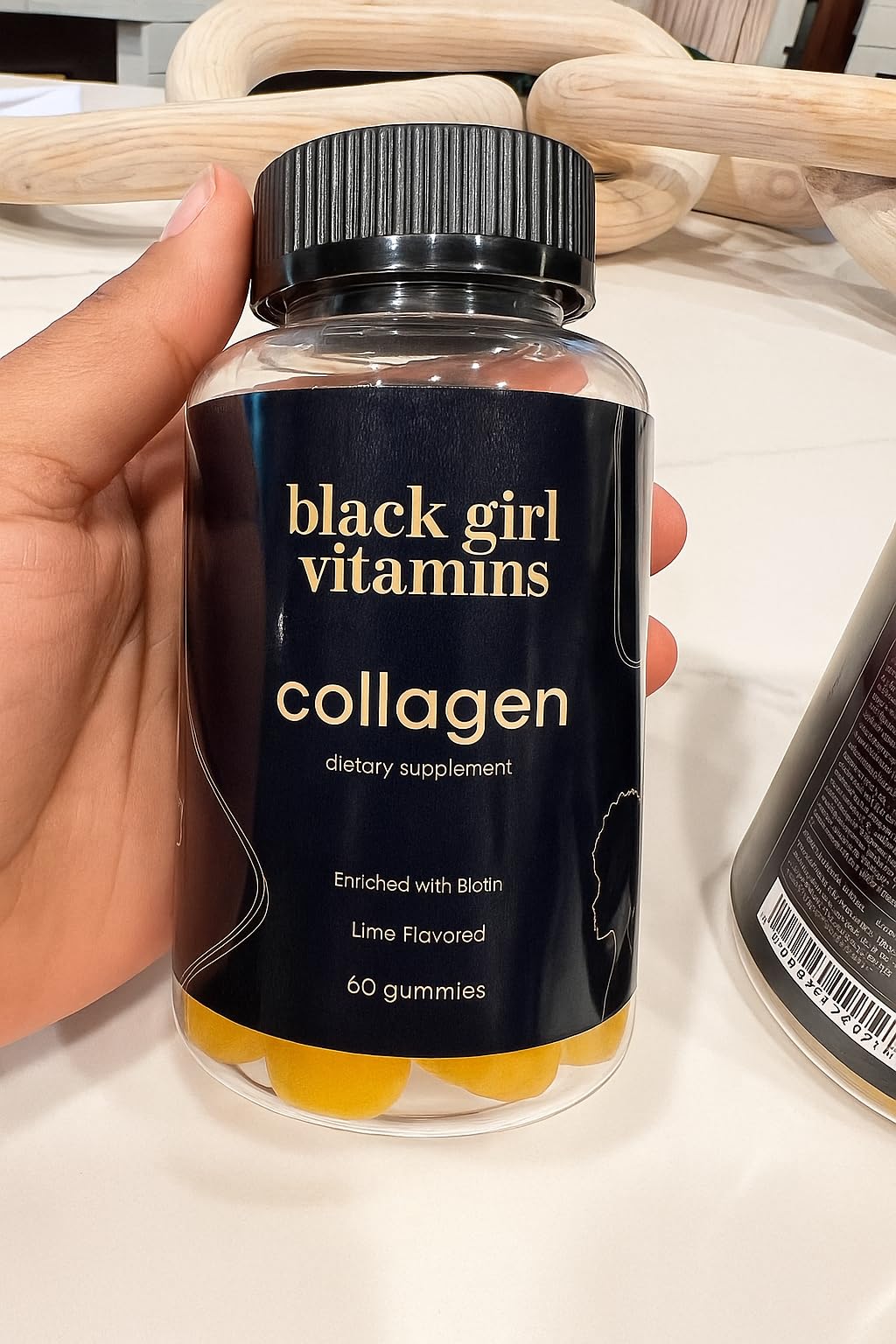 Black Girl Vitamins collagen gummies lime nails hair: lifestyle shot showing beauty routine.