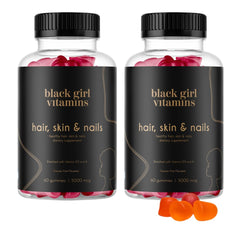 Black Girl Vitamins bottle pouring passion fruit gummies for hair and nails.