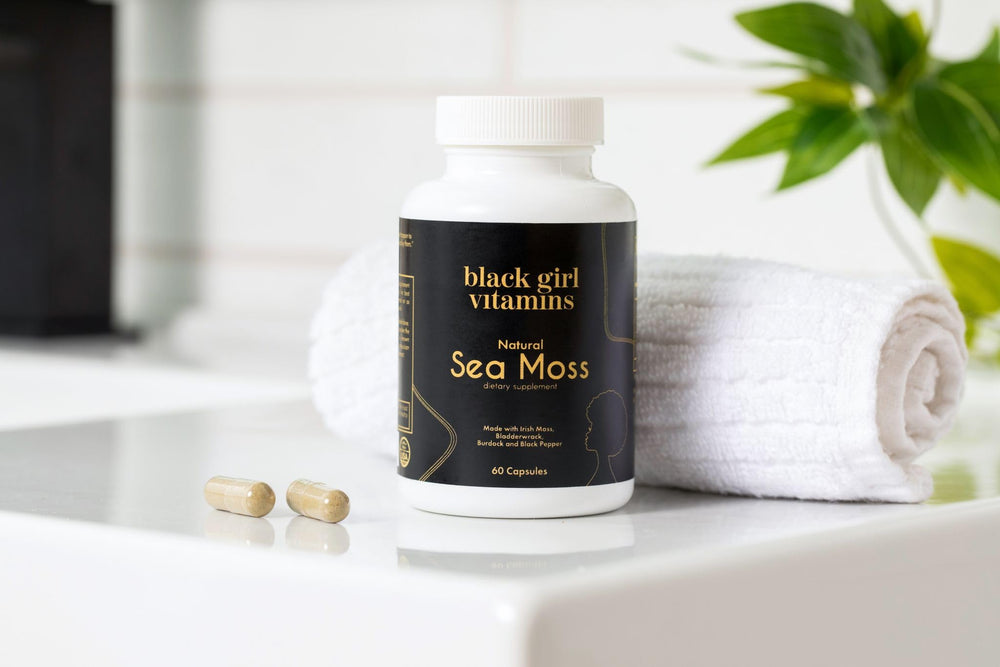Black Girl Vitamins sea moss capsules lifestyle scene implies a simple routine for thyroid and digestion support.