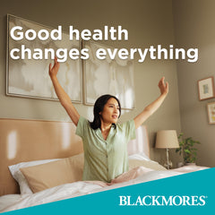 Blackmores Executive B bottle beside planner suggests support for productive days.
