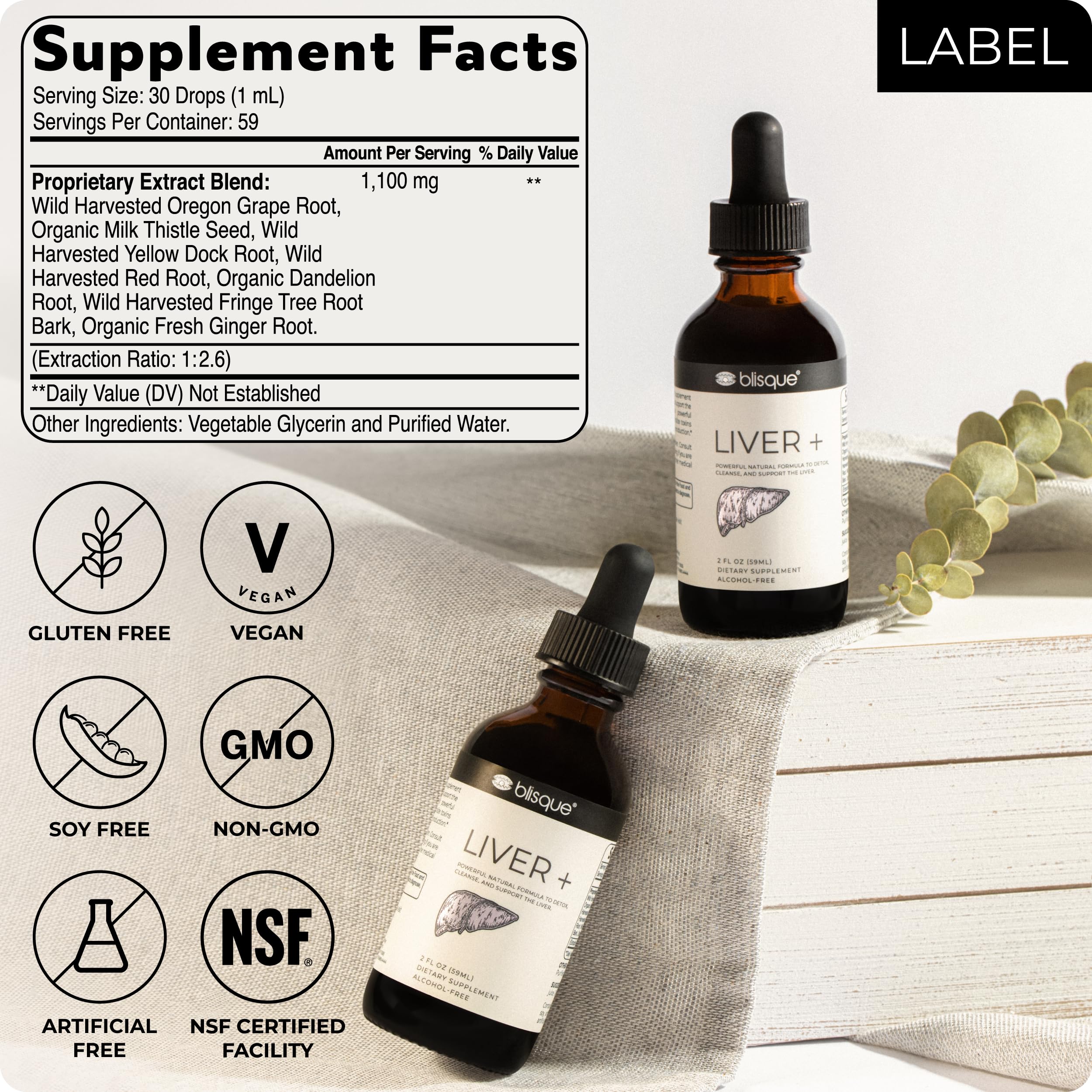 Blisque LIVER+ glass with bottle on counter, natural supplement for energy and digestion.