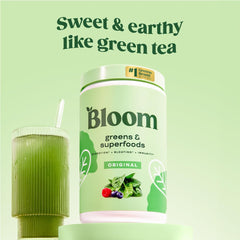 Glass of juice stirred with Bloom Greens Original for easy nutrition