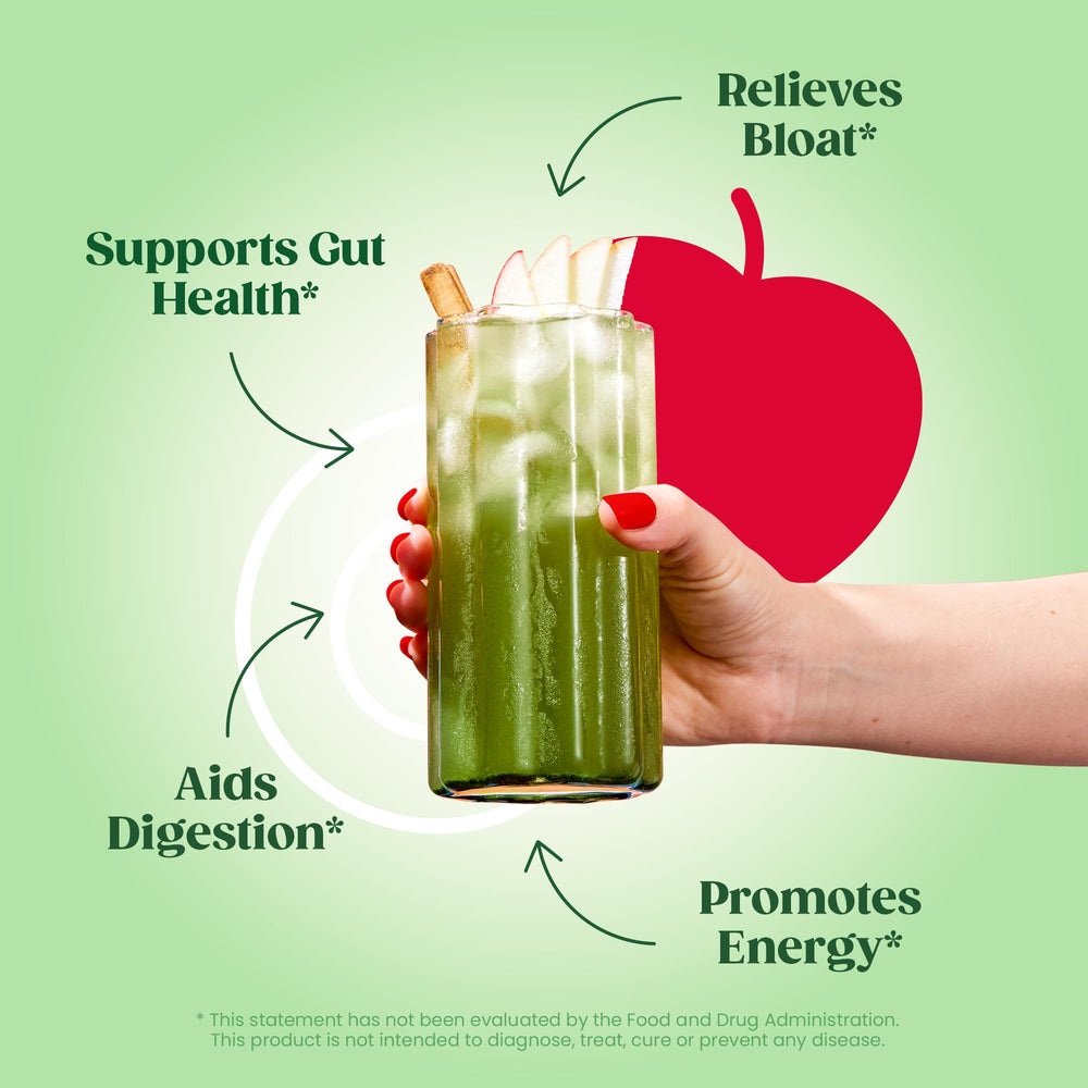 Bloom Nutrition greens powder scoop poured into a glass for a convenient energy boost.