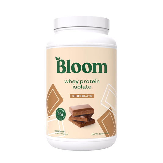Bloom Nutrition Whey Isolate Chocolate powder in a jar for post-workout recovery.
