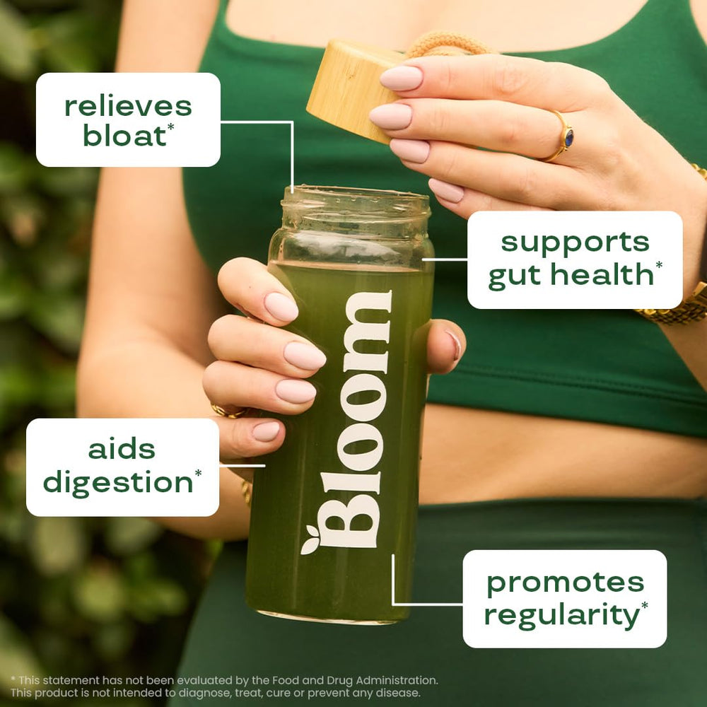 Bloom Nutrition greens powder jar closeup; contains probiotics and prebiotics