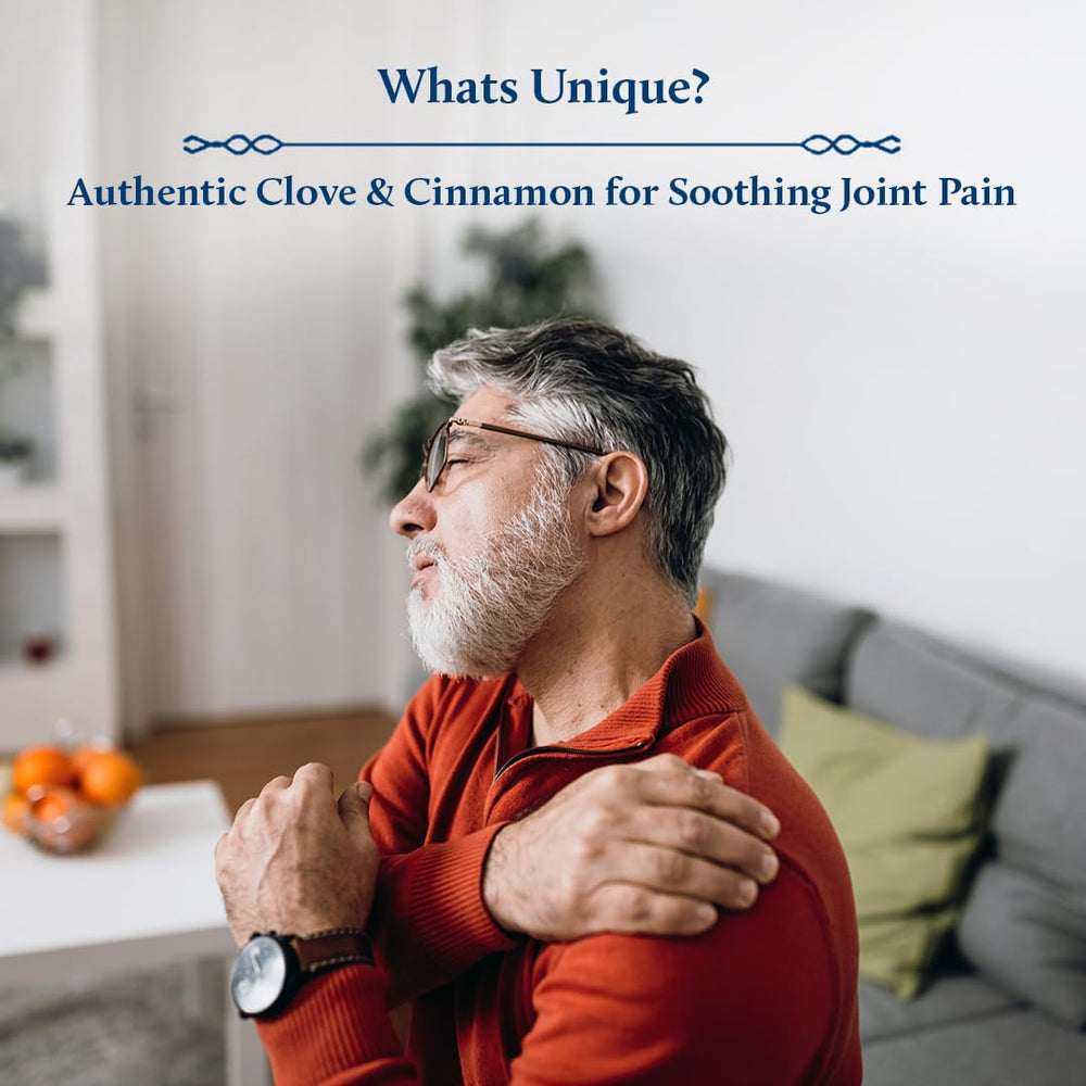 Hands massaging Blue Nectar oil into the shoulder and neck area