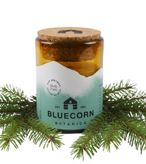 Bluecorn Beeswax Candle in amber glass holder glows with warm, clean light