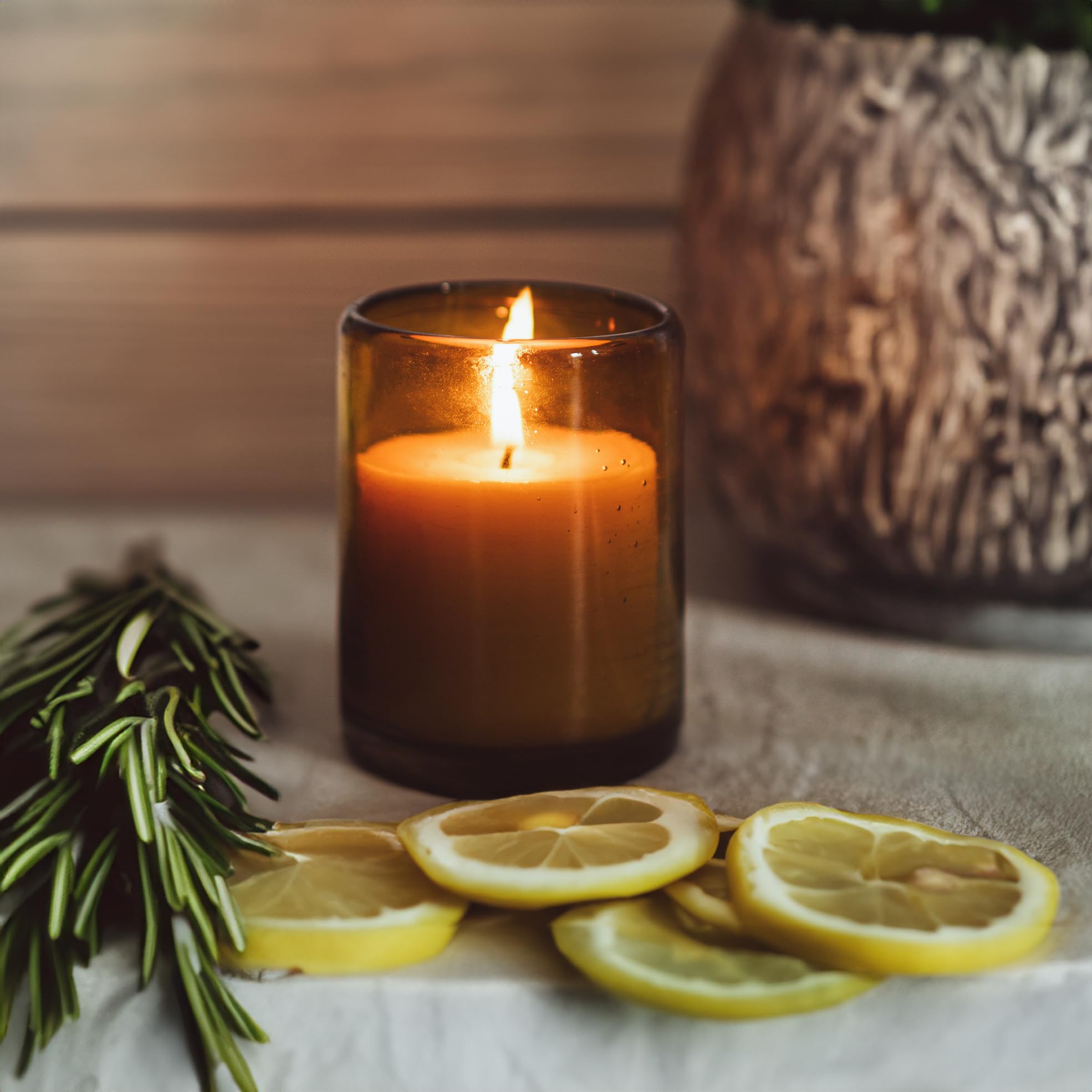 Decorative amber glass jar from Bluecorn Beeswax Candle enhances decor